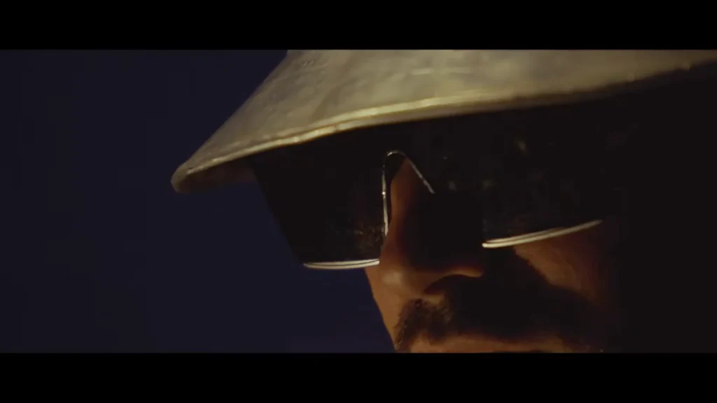 LA Priest wearing a futuristic silver outfit in the Into The Sky music video