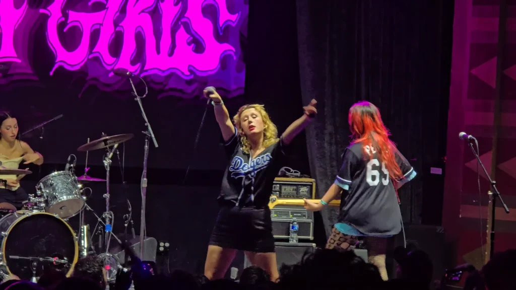 Lambrini Girls performing in a packed Los Angeles venue
