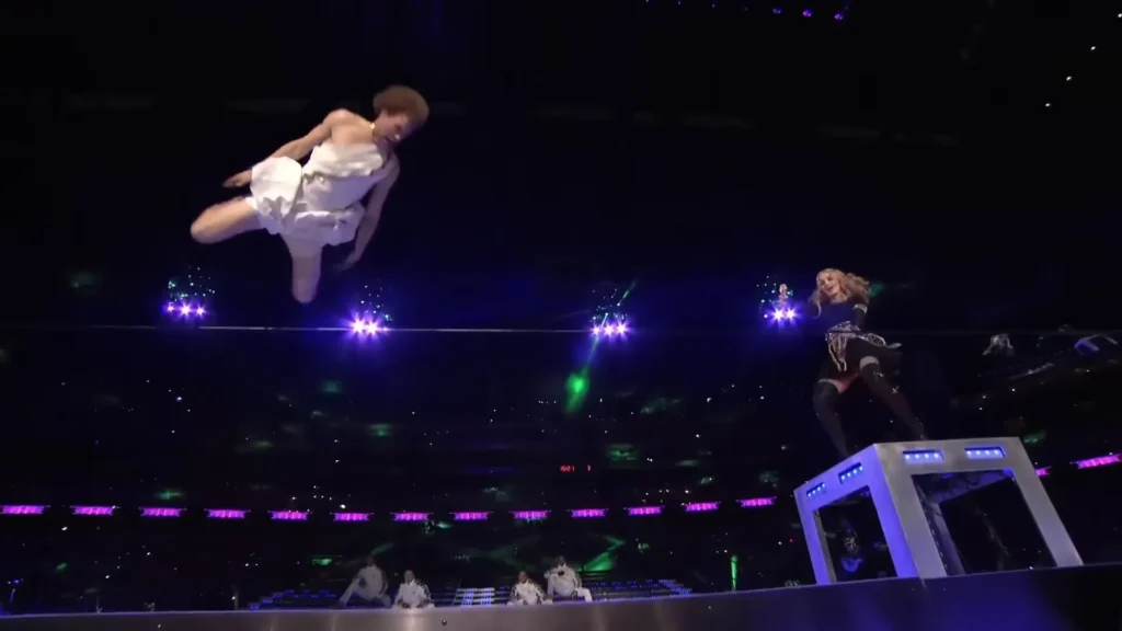 Andy Lewis flipping on a slackline during Madonna's Super Bowl performance