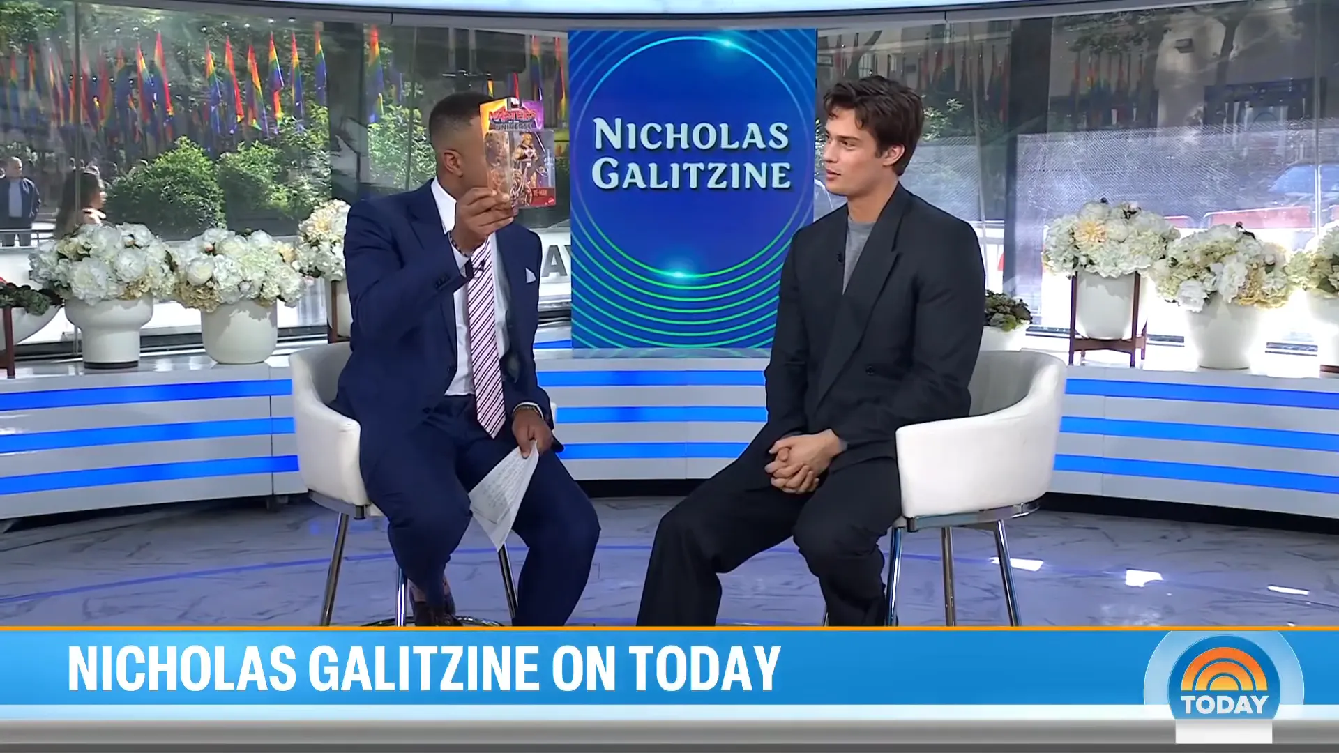 Nicholas Galitzine reacting to his He-Man action figure during his TODAY interview