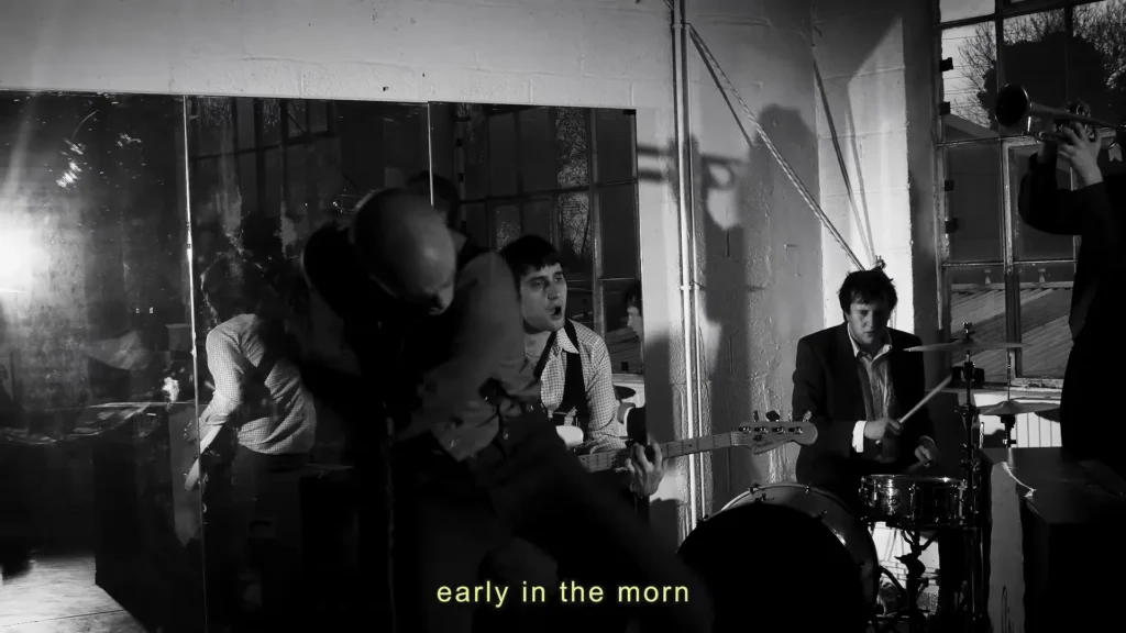 Opus Kink performing in the Come Over, Do Me Wrong music video