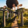 Rapsody in the “God Gotta Afro” music video featuring Karabo Ya Morena.
