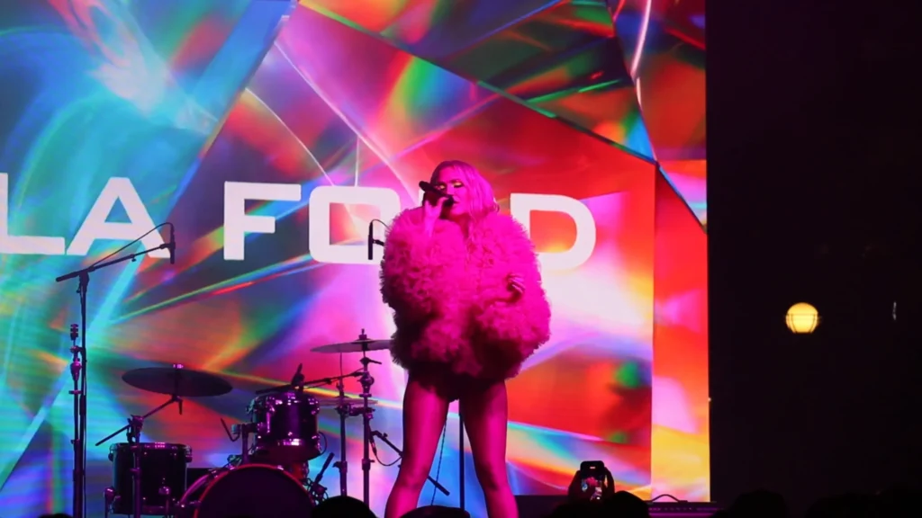 Willa Ford sings alongside live string players during her WeHo Pride performance