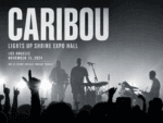 Caribou performs live at Shrine Expo Hall in Los Angeles on November 13, 2024, silhouetted against dramatic backlighting as the crowd raises their hands.