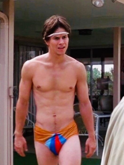 Mark Wahlberg as Dirk Diggler with Philip Seymour Hoffman as Scotty J. in Boogie Nights