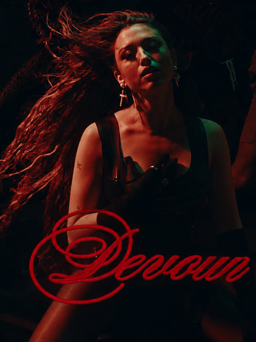 Rêve in a dark red-and-green nightclub scene with the song title “Devour” written in red script across the lower image.