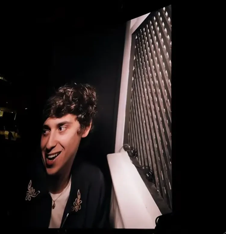 Marcello Hernández smiling during Rosalía's LUX Tour confessional segment