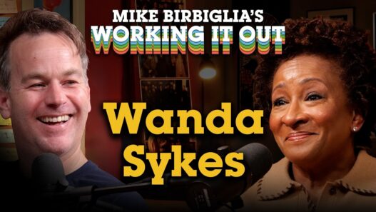 Wanda Sykes and Mike Birbiglia smiling during an episode of Working It Out
