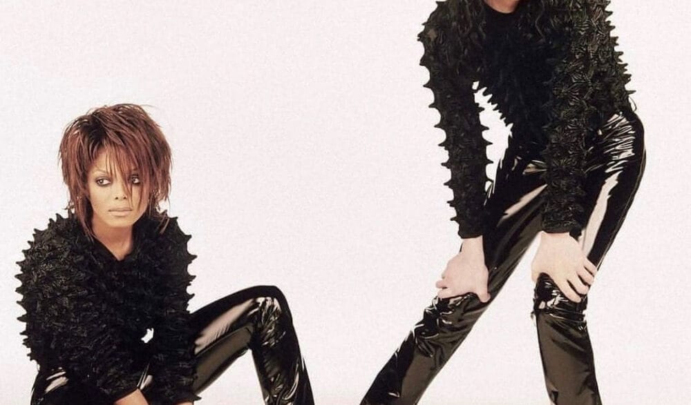 Janet Jackson leaning against Michael Jackson during the futuristic Scream music video era