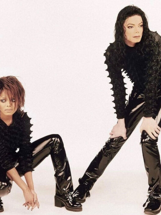 Janet Jackson leaning against Michael Jackson during the futuristic Scream music video era