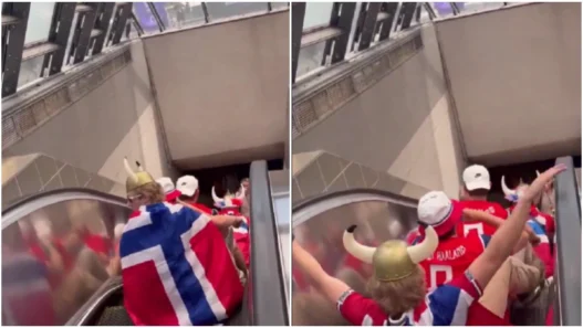 Norway fans doing the Viking Row on an escalator before a FIFA World Cup match in Boston