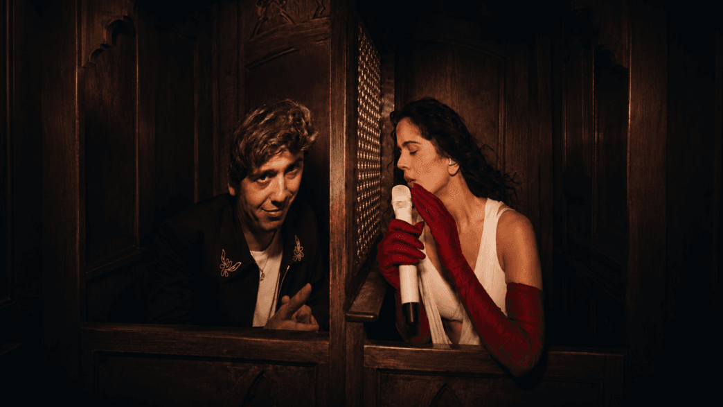 Rosalía and Marcello Hernández celebrate together onstage during her LUX Tour confessional segment in NYC.