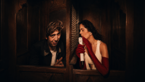 Rosalía and Marcello Hernández celebrate together onstage during her LUX Tour confessional segment in NYC.