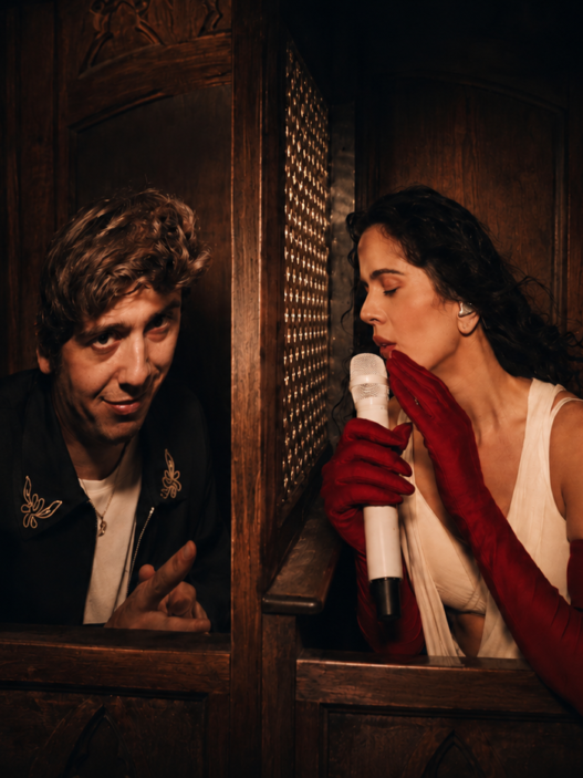 Rosalía and Marcello Hernández celebrate together onstage during her LUX Tour confessional segment in NYC.