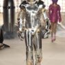 Model walks the Berlin Fashion Week runway in a bold Marina Hoermanseder SS27 Outer Space collection look.