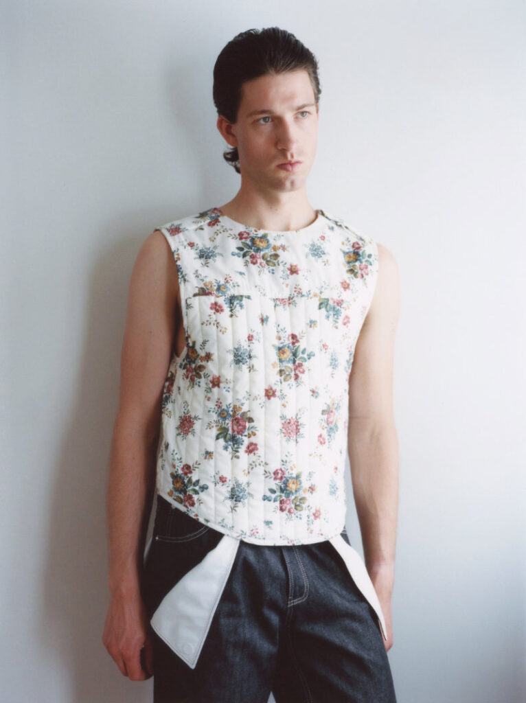 A model wearing Timothy Li Series 3 in the collection’s lived-in interior setting