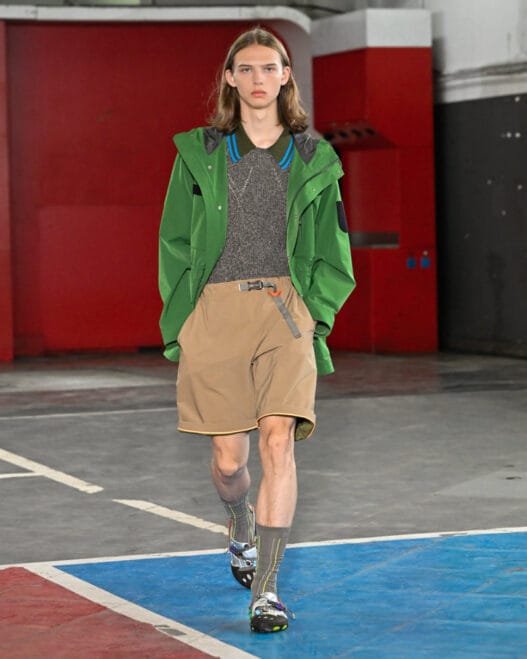 A runway look from kolor Spring/Summer 2027 featuring the label’s off-kilter tailoring and hybrid styling.