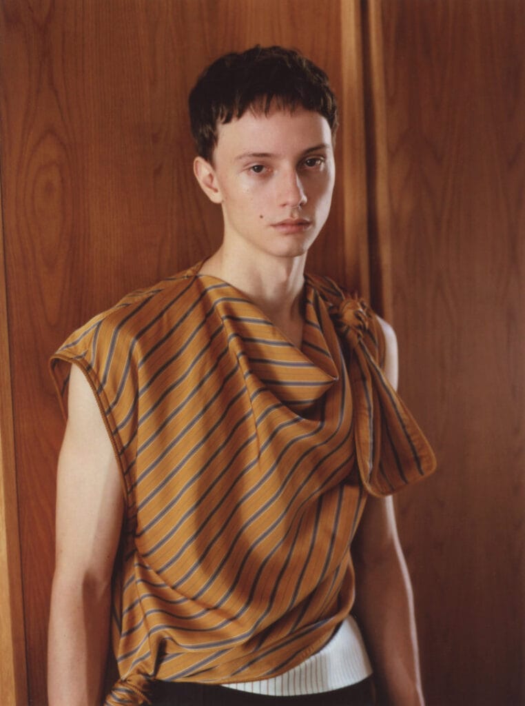A model wearing Timothy Li’s Series 3 collection inside its intimate apartment setting