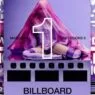 Madonna beneath a pink veil celebrating Confessions II reaching No. 1 on the Billboard 200