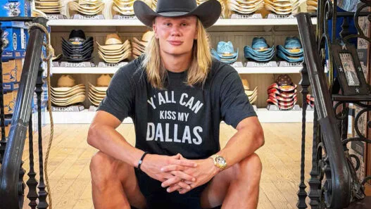 Erling Haaland visits Wild Bill’s Western Store in Dallas during the World Cup, posing in a cowboy-inspired Texas style moment.