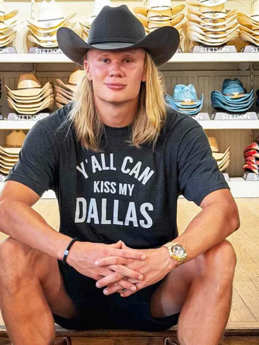 Erling Haaland visits Wild Bill’s Western Store in Dallas during the World Cup, posing in a cowboy-inspired Texas style moment.