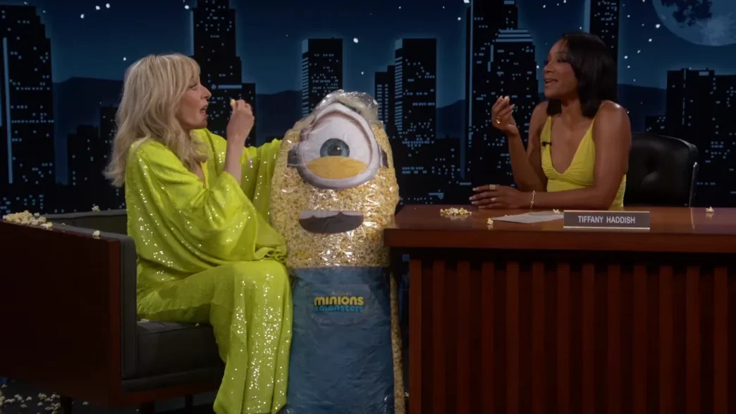 Allison Janney smiles in a bright yellow outfit during her Jimmy Kimmel Live interview with guest host Tiffany Haddish.