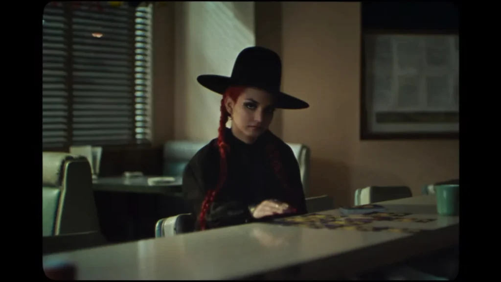 Ambar Lucid performing amid surreal lighting in the Get Lost In The Music video