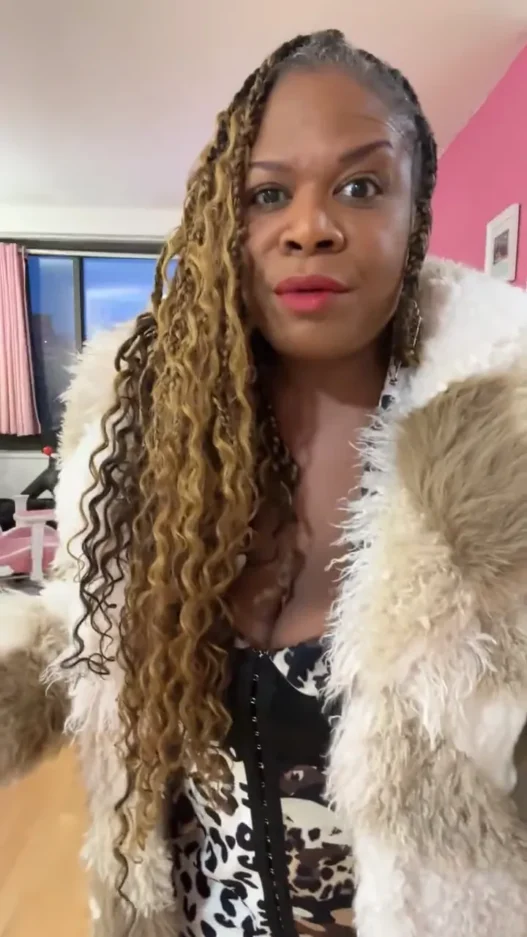 Yamaneika Saunders reacts during her Andy Played Me live video after getting dressed for the wrong event date.