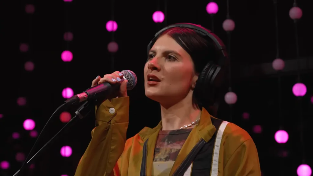 Izzy Glaudini sings and plays synth during Automatic’s KEXP performance