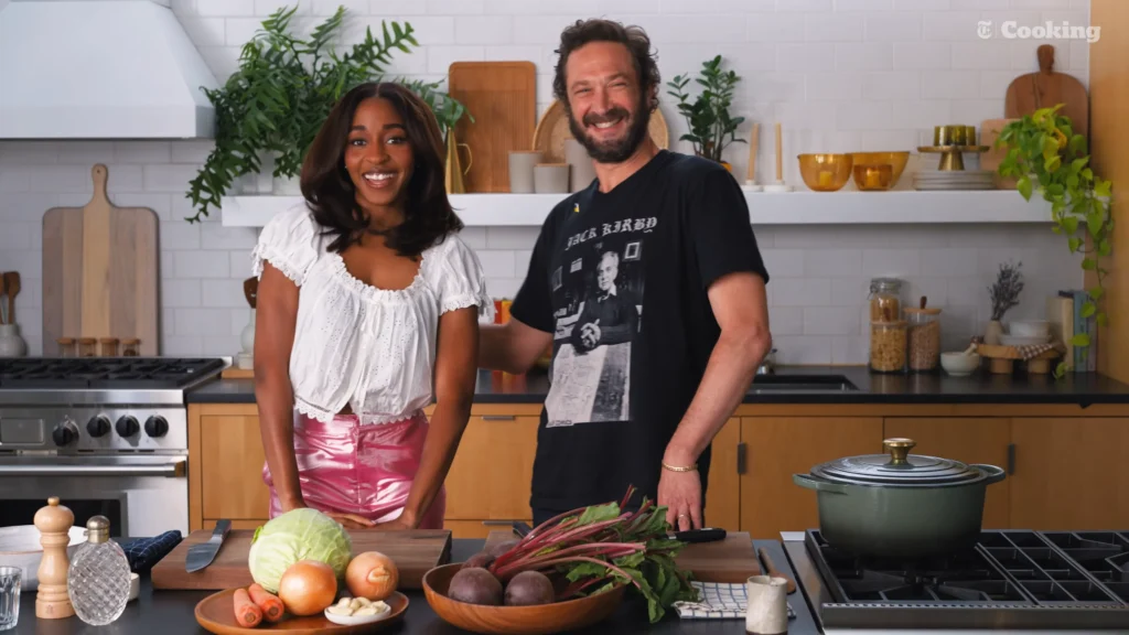 Ayo Edebiri and Ebon Moss-Bachrach beginning the borscht recipe in the NYT Cooking kitchen