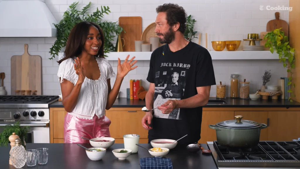 Ayo Edebiri tasting cold vegetarian borscht with sour cream and dill