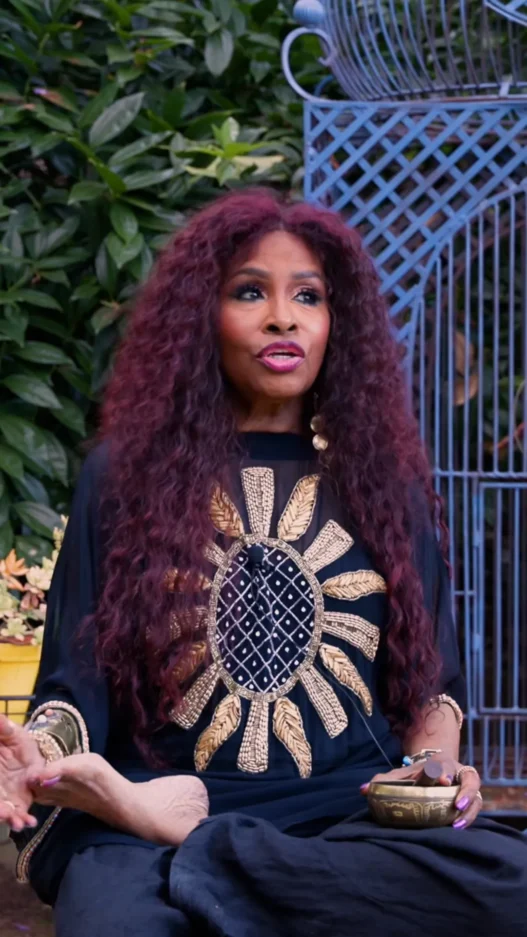 Chaka Khan guiding her July New Moon Meditation in a softly lit room