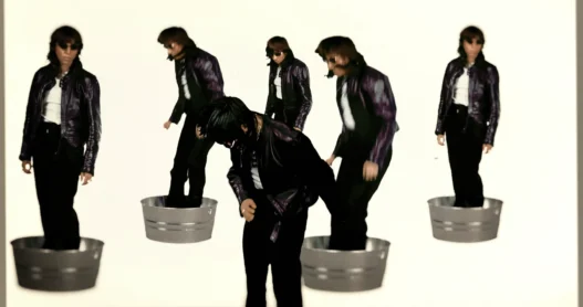 Multiple versions of Chloé Caillet dancing in metal tubs against a white background in the Bad Bara video