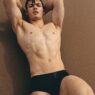 Colin Walling poses with wet skin in a smoldering portrait photographed by Adam Washington