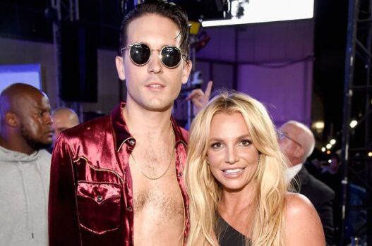 Britney Spears smiling beside G-Eazy backstage during the 2016 Make Me era