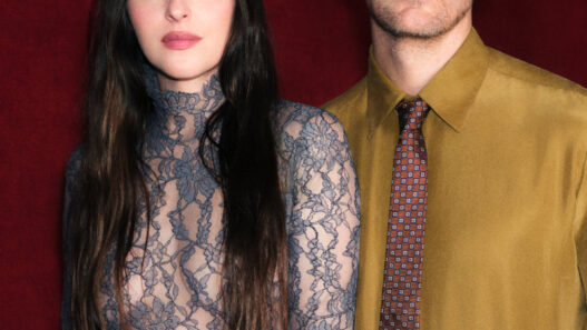 Dakota Johnson appears in a Valentino Beauty portrait for the brand’s new fragrance era with Alexander Skarsgård.