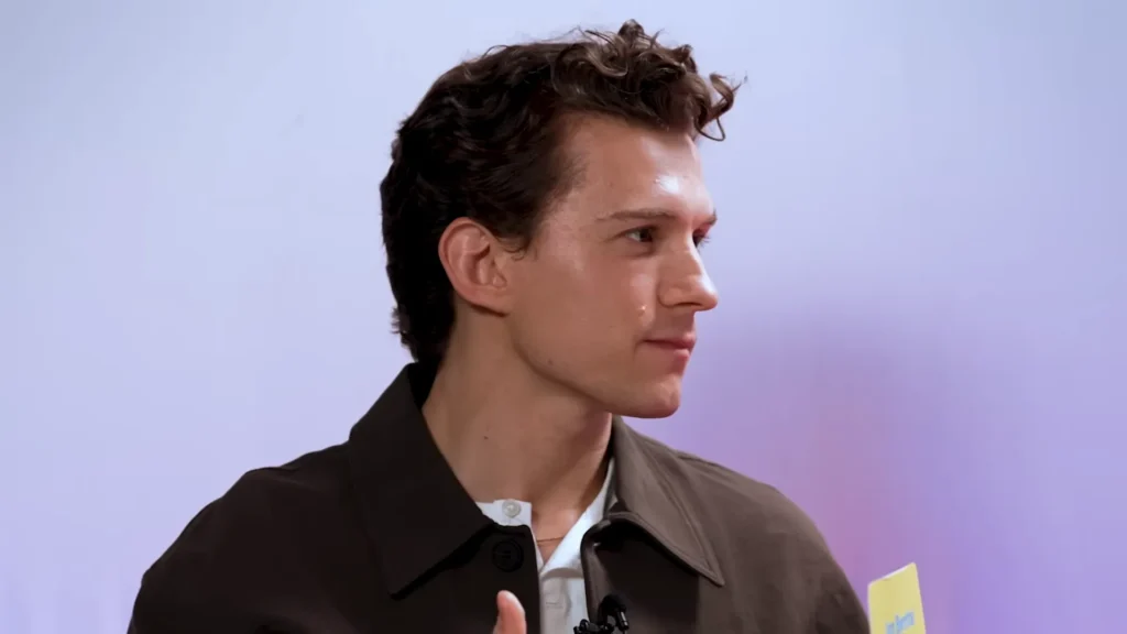 Tom Holland asks questions during The Odyssey cast’s MTV UK guessing game