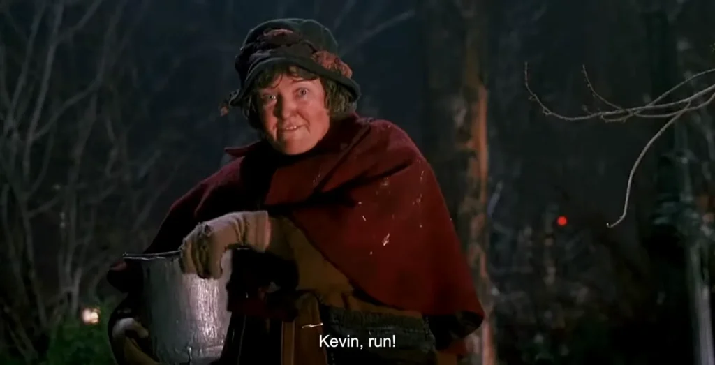 The Pigeon Lady confronts the Sticky Bandits during the Central Park rescue in Home Alone 2