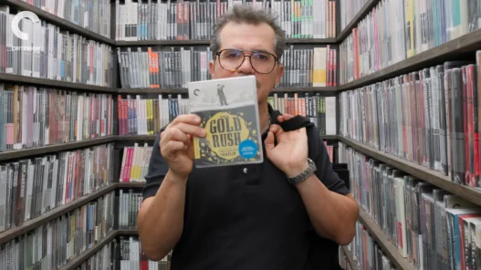 John Leguizamo browsing films and discussing his selections inside the Criterion Closet
