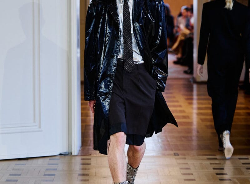A model opens the John Lawrence Sullivan Spring/Summer 2027 runway at Berlin Fashion Week in a sharp black look.