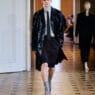 A model opens the John Lawrence Sullivan Spring/Summer 2027 runway at Berlin Fashion Week in a sharp black look.
