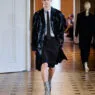 A model opens the John Lawrence Sullivan Spring/Summer 2027 runway at Berlin Fashion Week in a sharp black look.