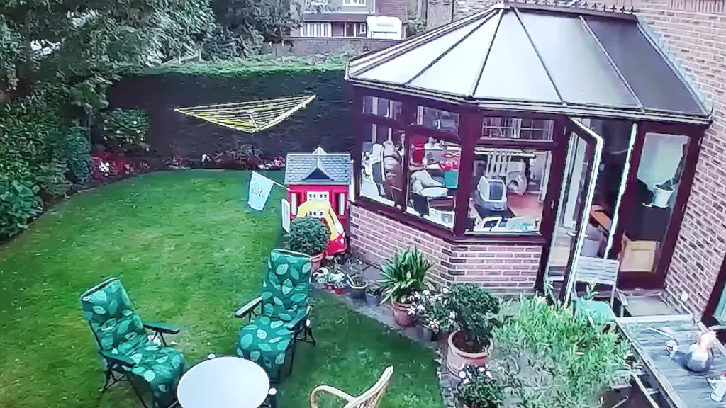 Suburban garden and conservatory seen in the official visualiser for Karma Kid and Uffie's Emergency