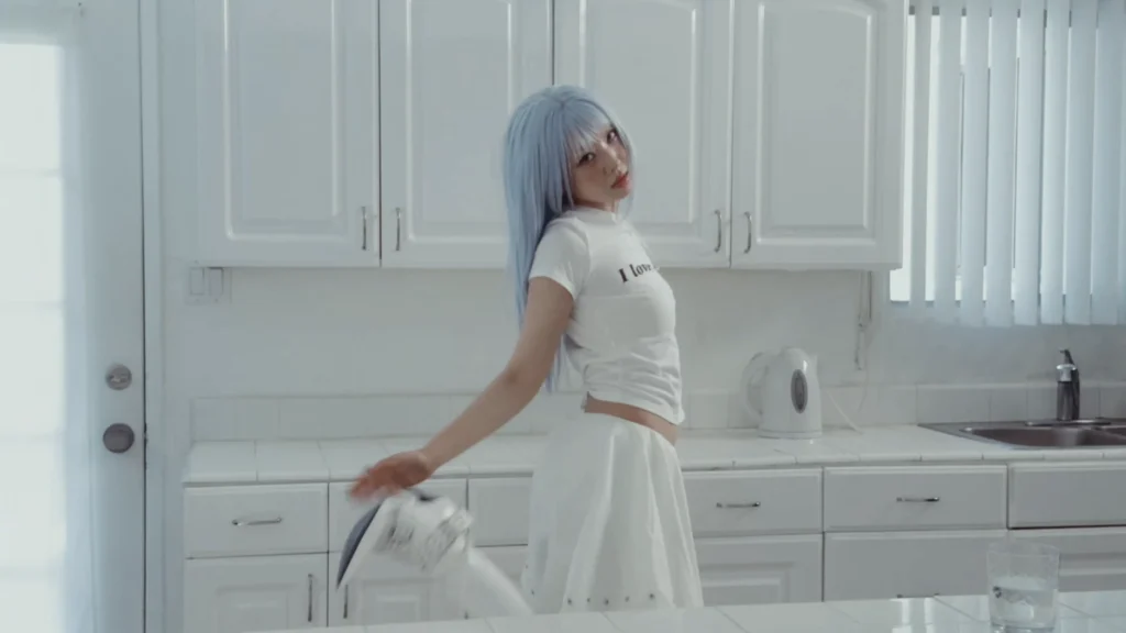 Lexie Liu and Yves in a stylized POP GIRL music video frame