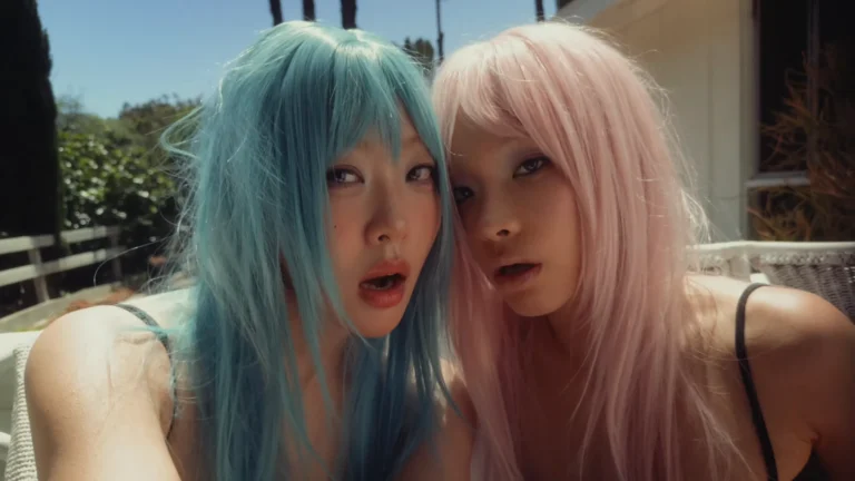 Lexie Liu and Yves in a stylized scene from their “POP GIRL” official music video