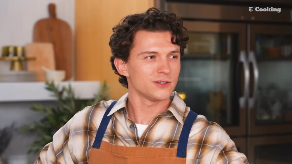 Tom Holland and Matt Damon working beside each other during The Pizza Interview