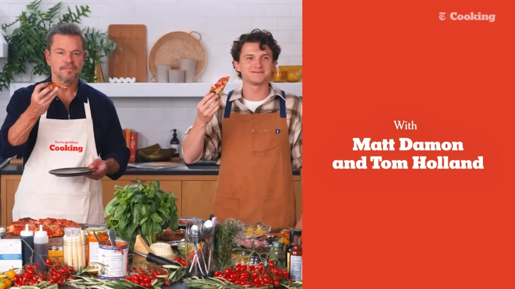 Matt Damon and Tom Holland presenting their finished pizzas during NYT Cooking’s Pizza Interview
