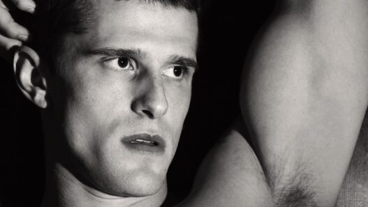 Matt van de Sande posing in an intimate portrait photographed by Giuseppe Riserbato