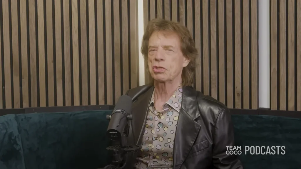 Mick Jagger and Conan O’Brien talking inside the compact London studio used for their podcast interview