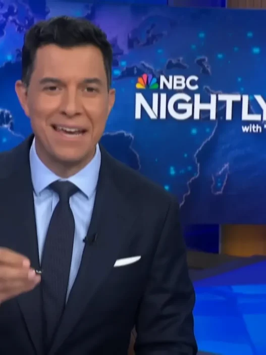 Tom Llamas smiling at the NBC Nightly News desk during the July 13 broadcast